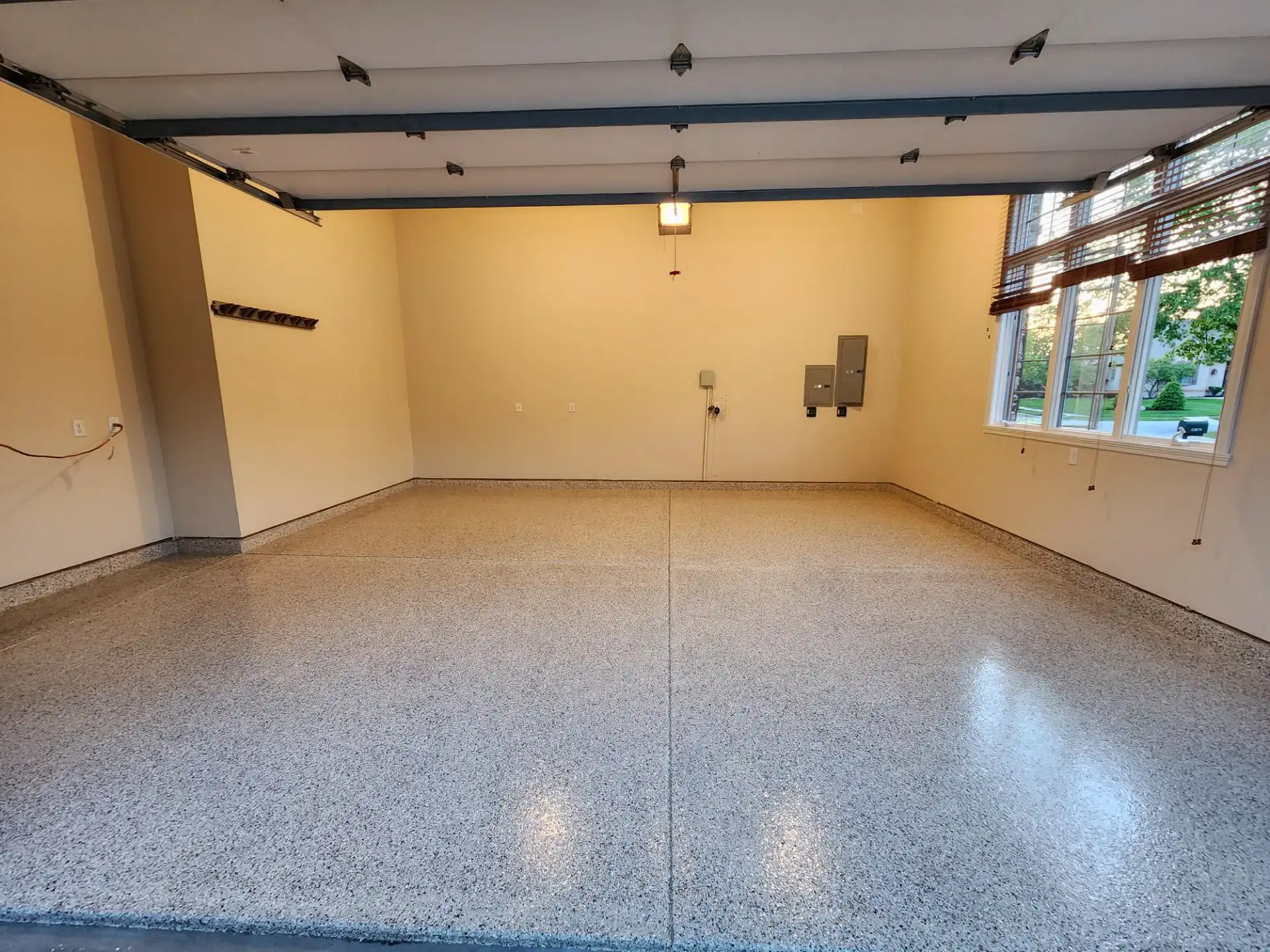 Best garage floor coating in Central Indiana: epoxy moisture-barrier base with full broadcast flake and polyaspartic topcoat by Guy Coatings in Fishers