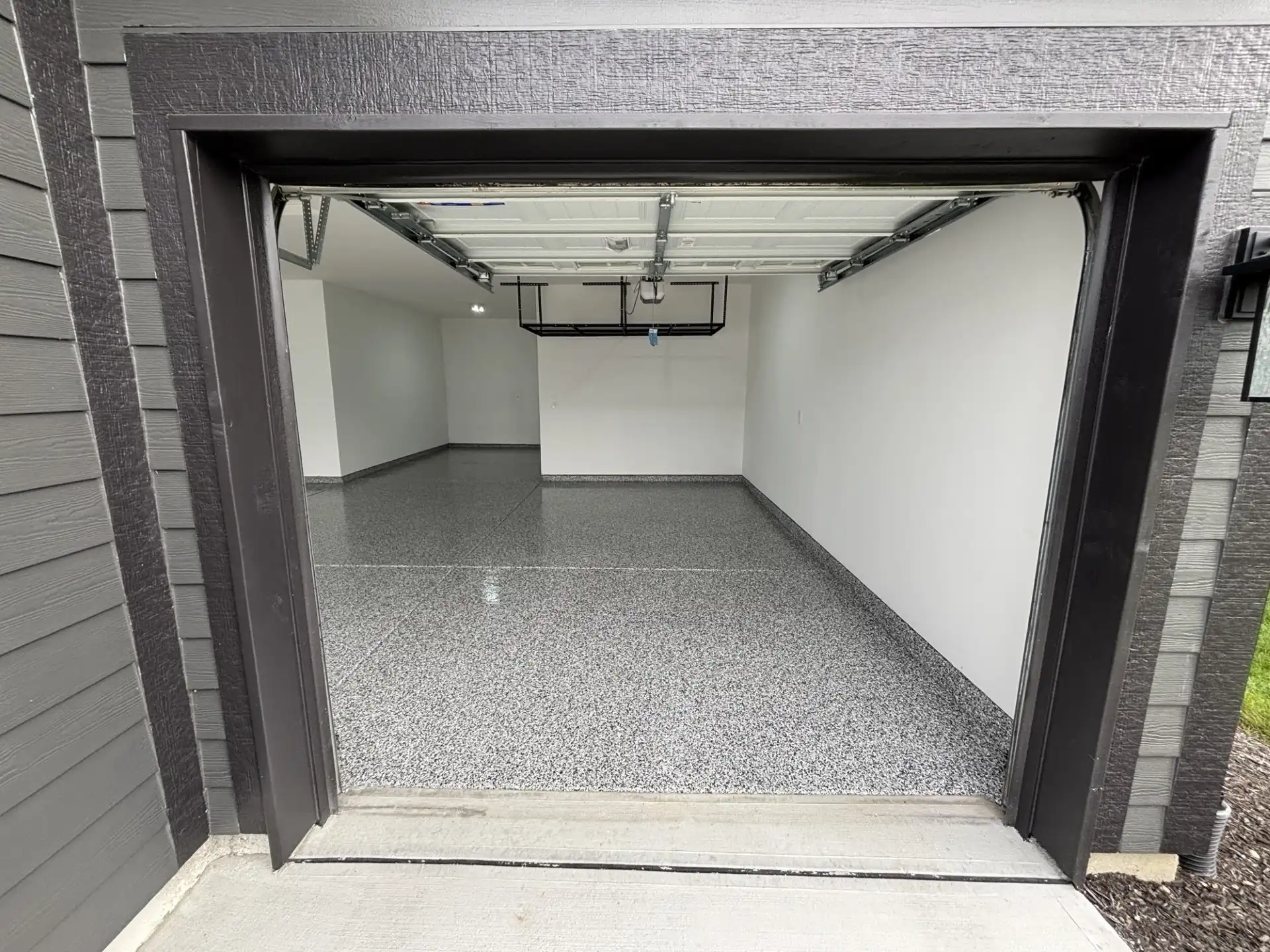 McCordsville garage after gray flake polyaspartic floor coating by Guy Coatings