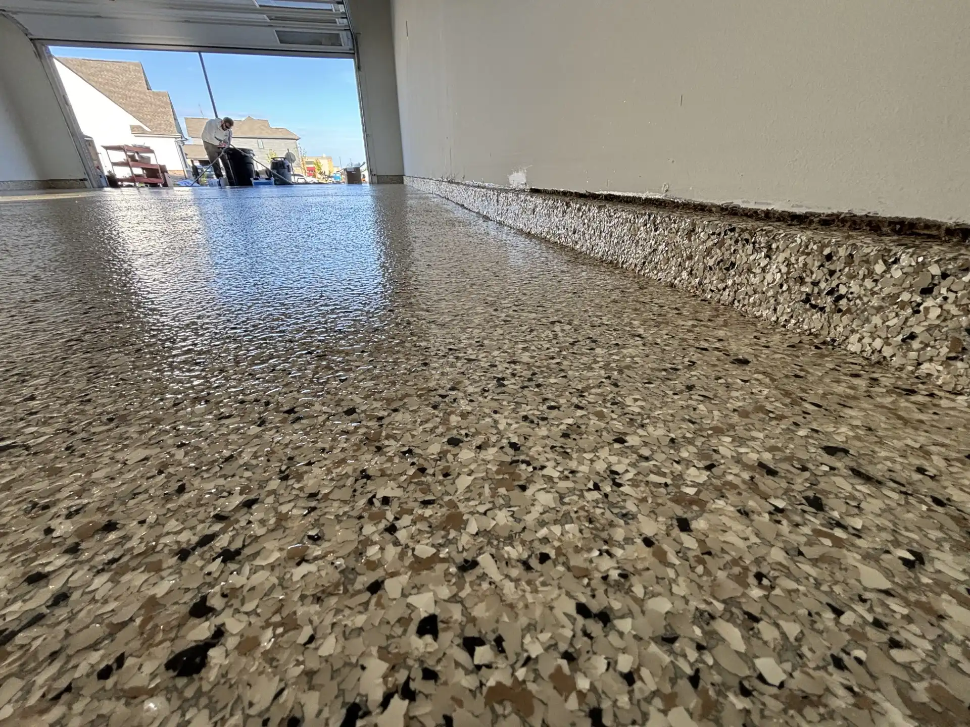 Long-lasting epoxy base garage floor coating with flake and polyaspartic topcoat installed by Guy Coatings in Noblesville Indiana