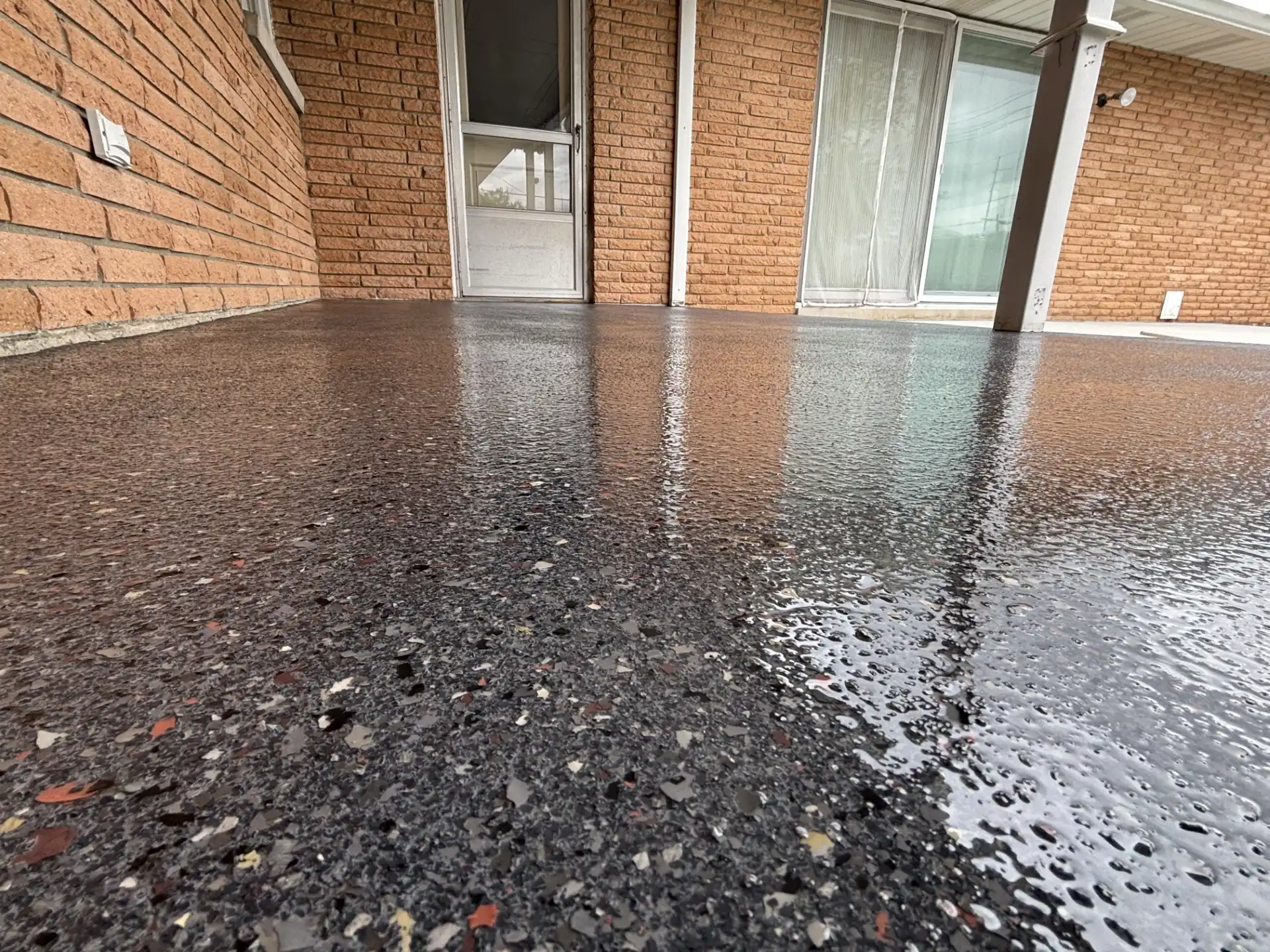Completed patio and pool deck polyaspartic flake coating by Guy Coatings in Central Indiana