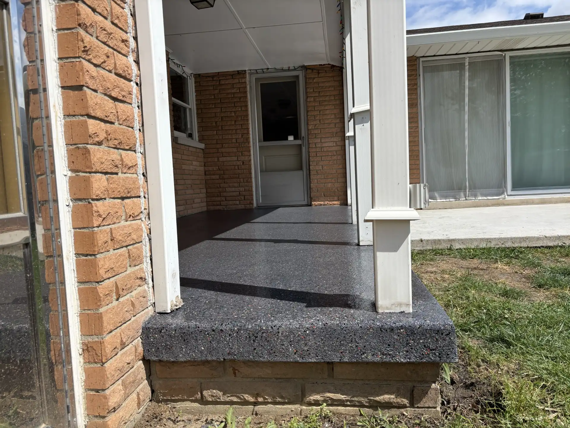 Concrete patio coating maintenance Central Indiana, Guy Coatings polyaspartic coated patio in Indiana backyard