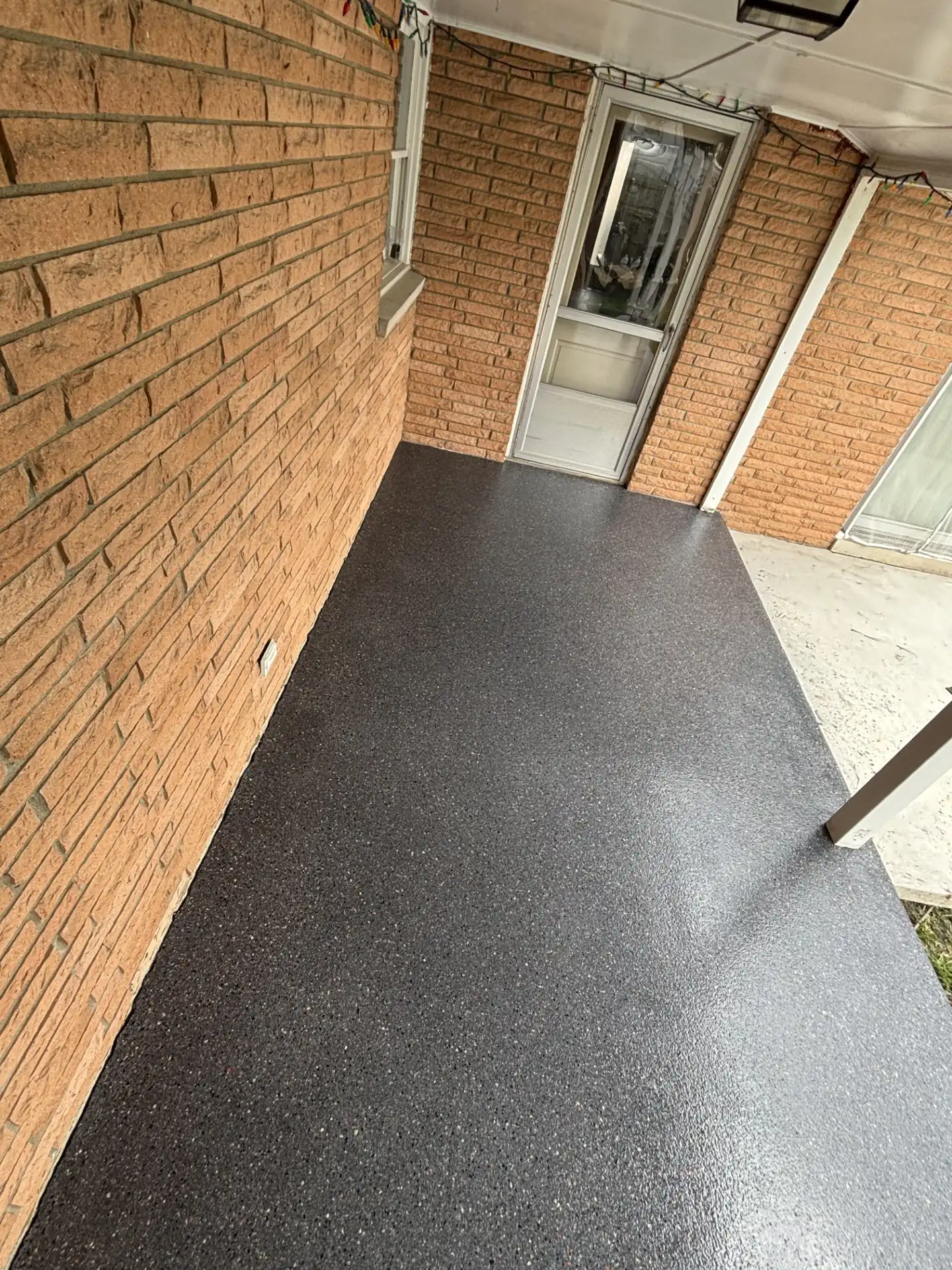 Polyaspartic-coated walkway with decorative flake finish in Carmel, Indiana by Guy Coatings