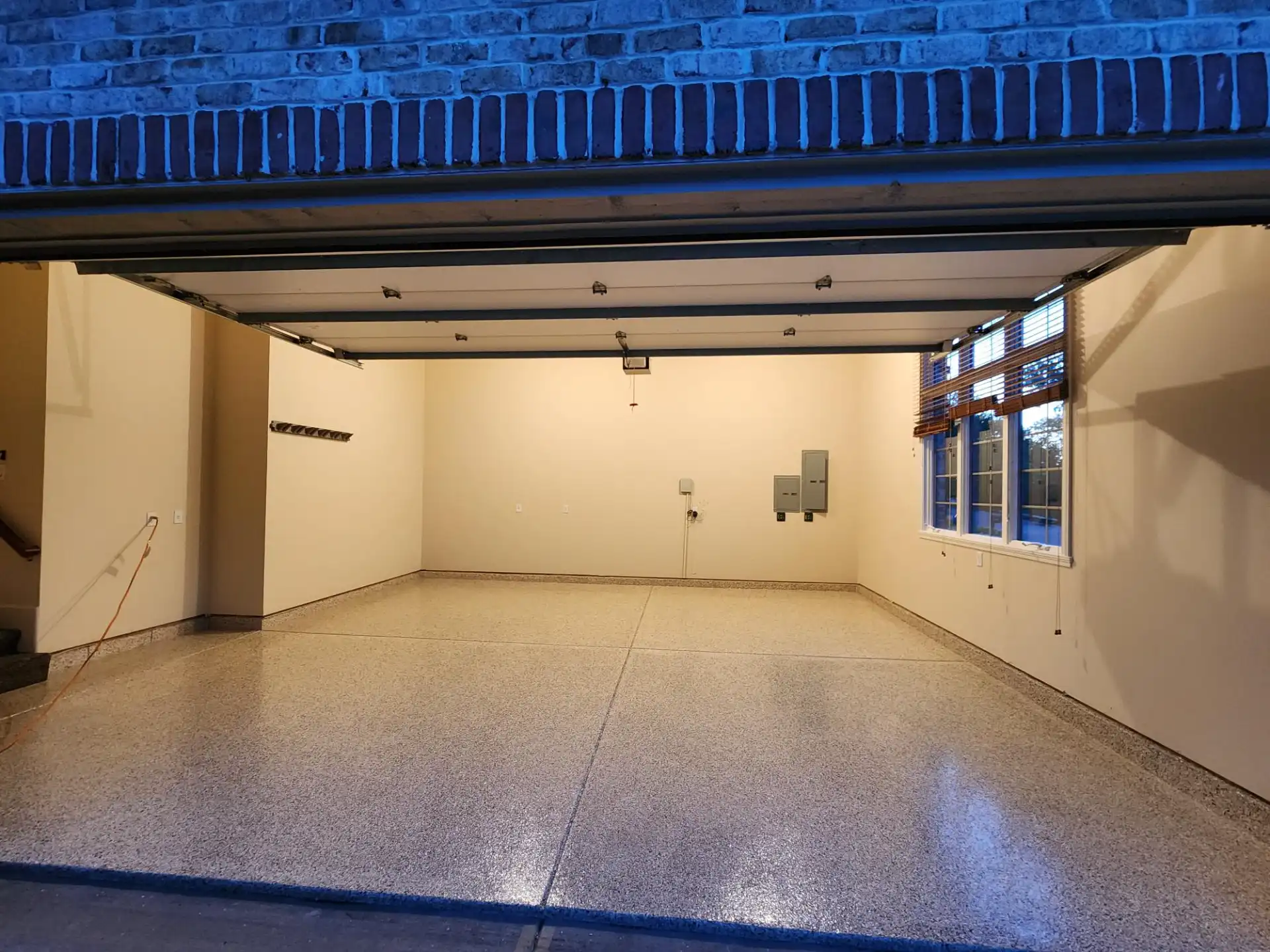 Concrete floor solution in Central Indiana: epoxy moisture-barrier base with flake and polyaspartic topcoat installed by Guy Coatings in Zionsville